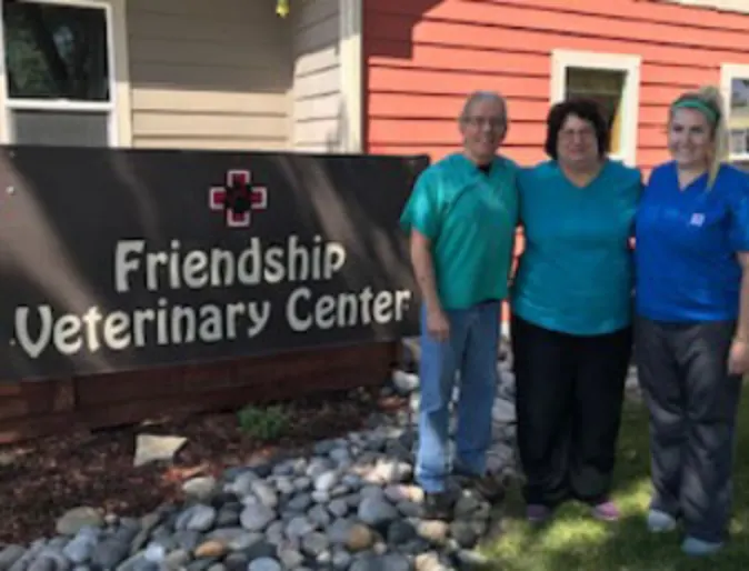 The staff and front sign of Friendship Veterinary Center